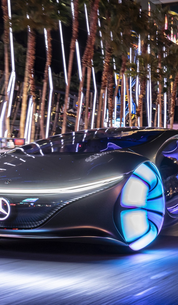 Автомобиль Mercedes-Benz VISION AVTR, 2020 года с неоновыми колесами на улице