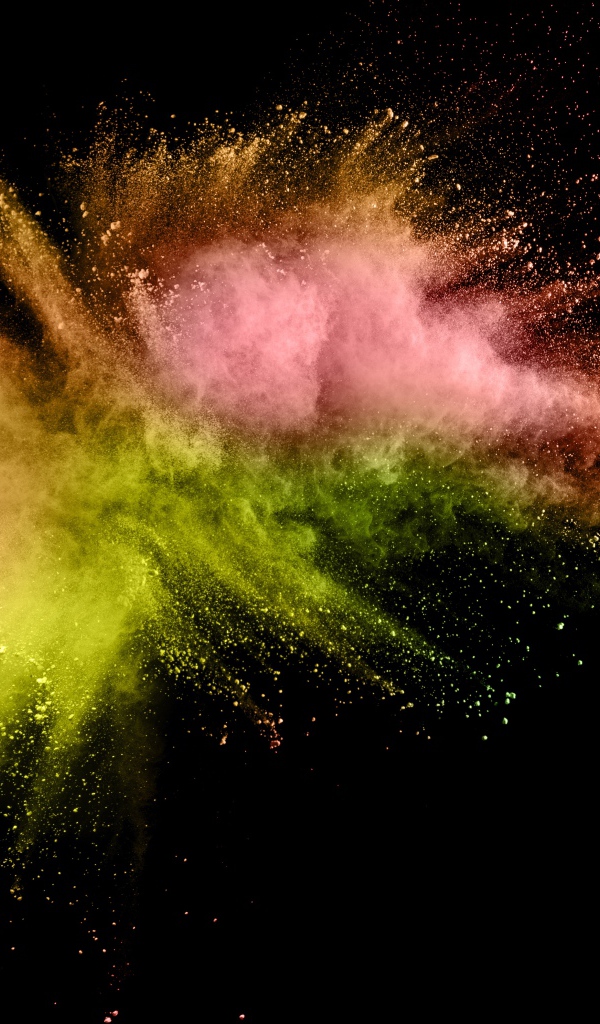 Взрыв разноцветной краски на черном фоне