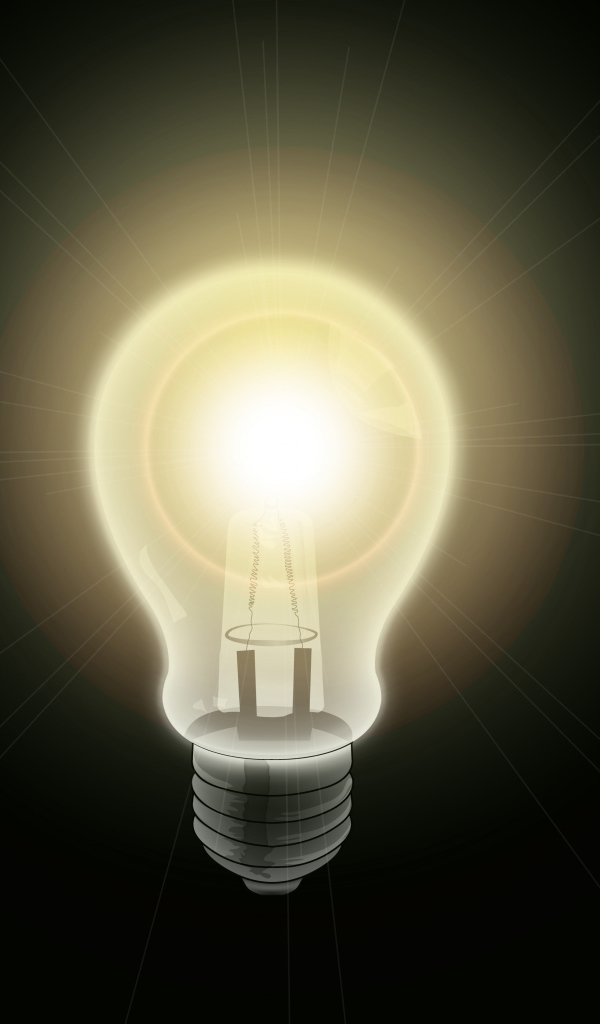 Зажженная лампа накаливания на черном фоне