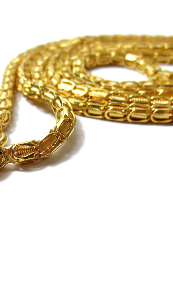 Big expensive gold chain on white background
