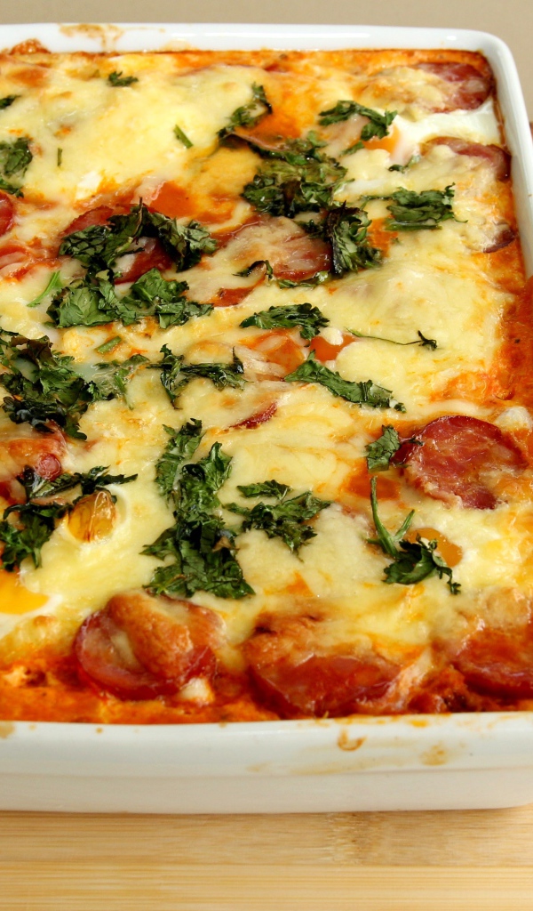 Casserole with sausage and cheese on the table