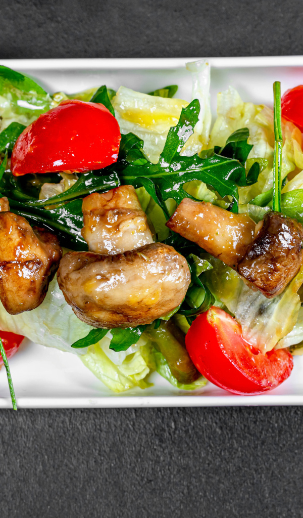 Salad with cabbage, fried mushrooms and tomatoes