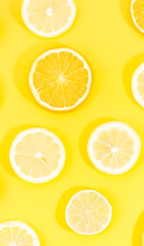 Orange and lemon circles on yellow background
