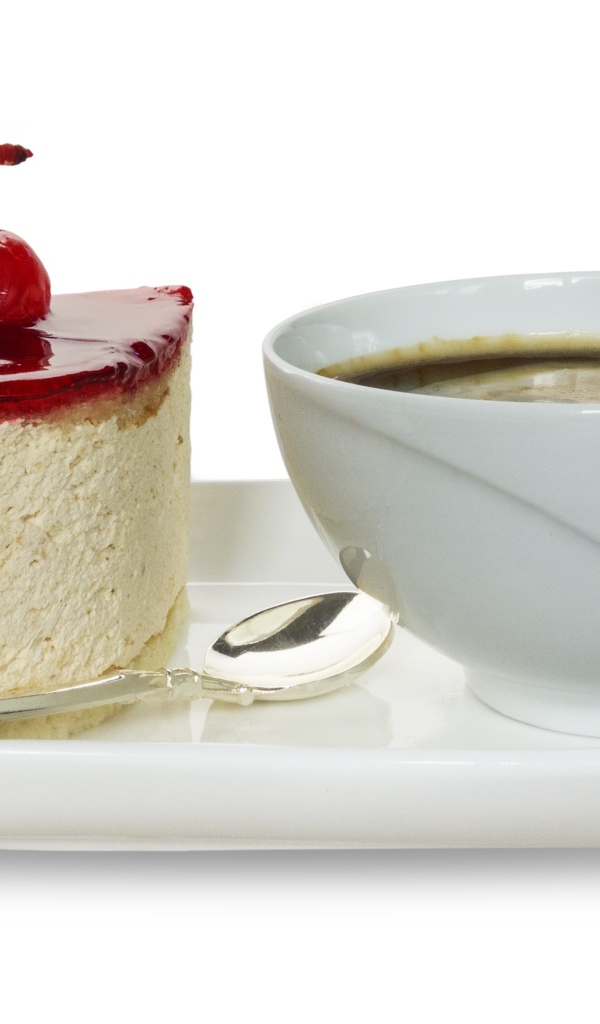 Пирожное с чашкой кофе на белом фоне