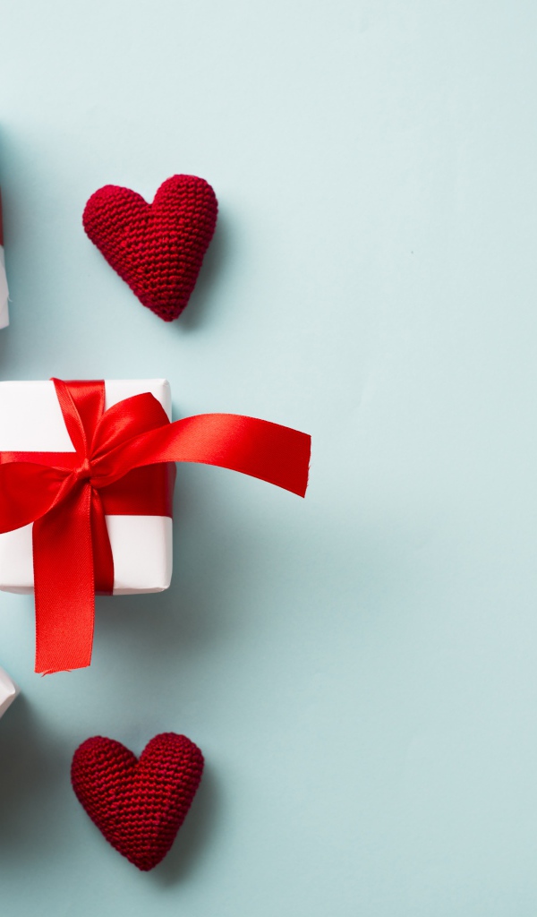 Gifts with red hearts on a blue background