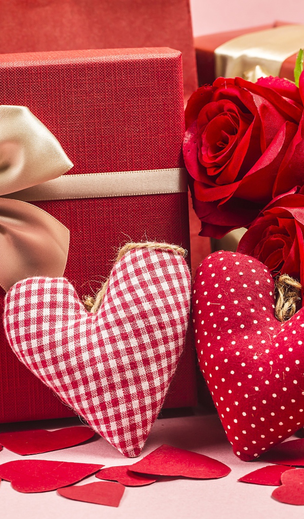 Two gifts with red roses and fabric hearts