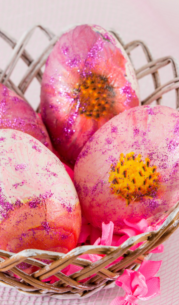Beautiful pink eggs in a basket for Easter