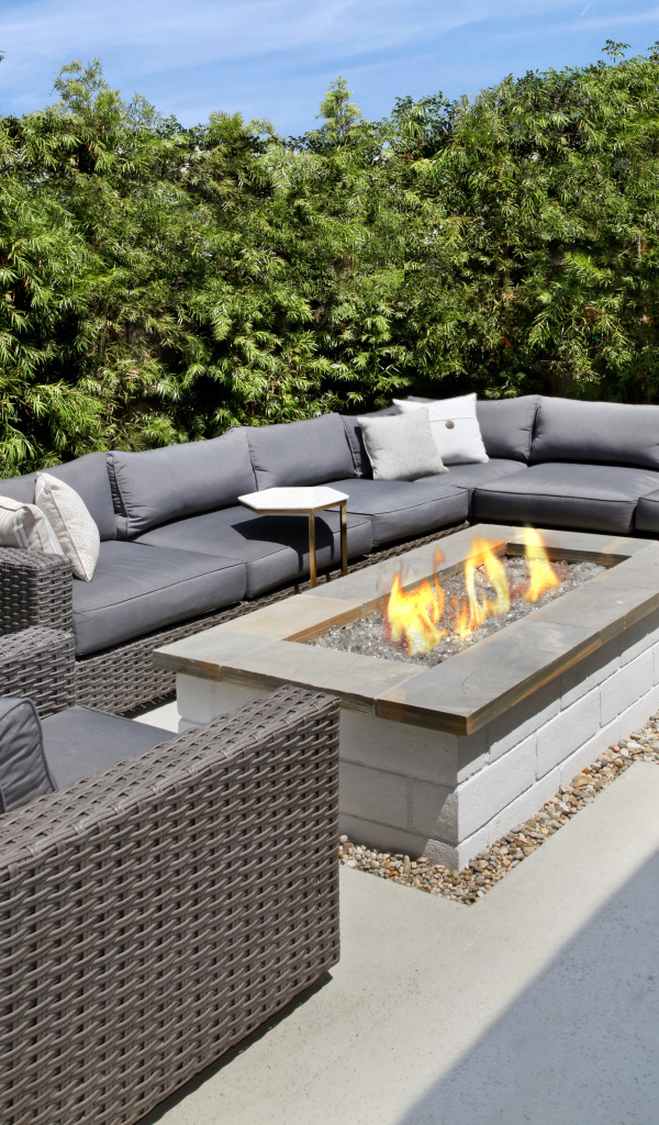 Large gray garden sofa with fireplace