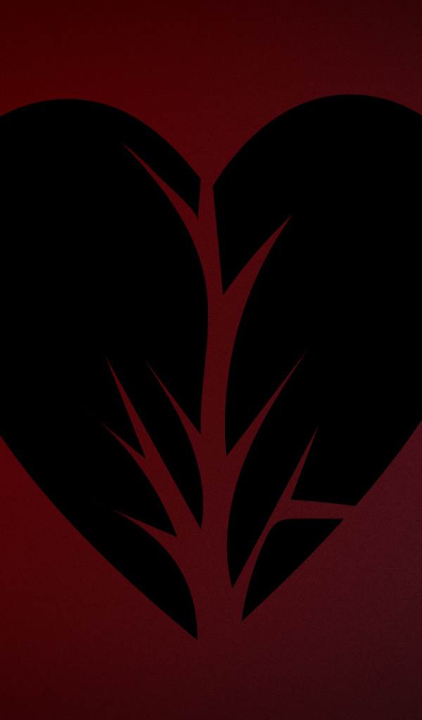 Черное разорванное сердце на красном фоне