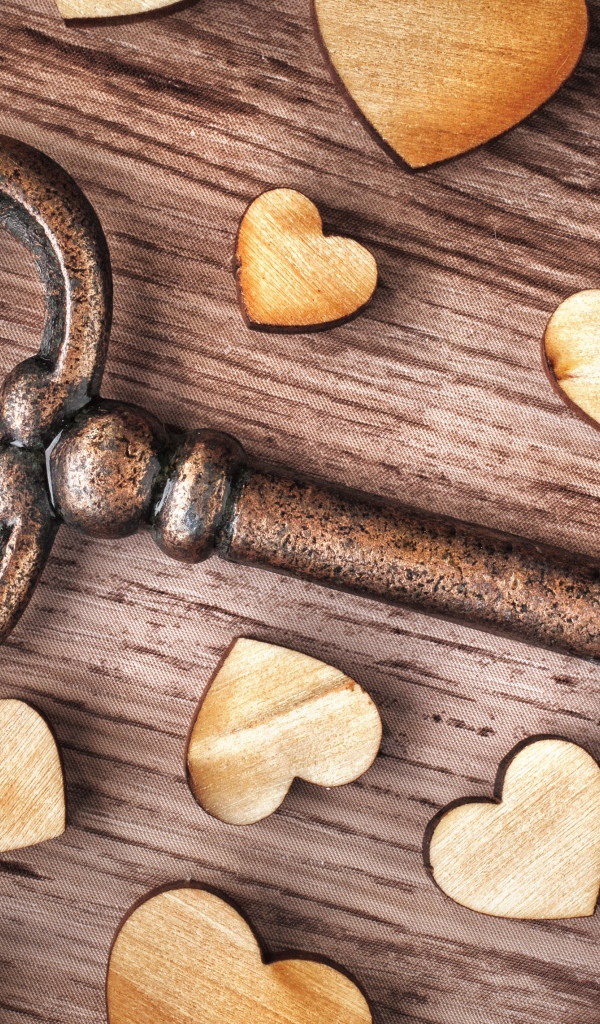 Large iron key with wooden hearts