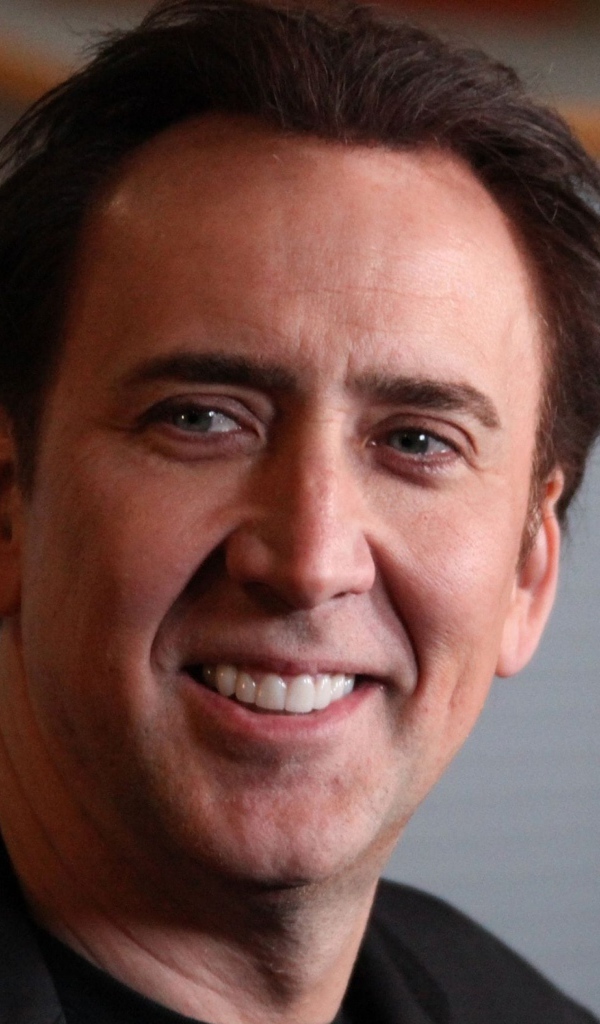 Улыбающийся мужчина,  актер Николас Кейдж