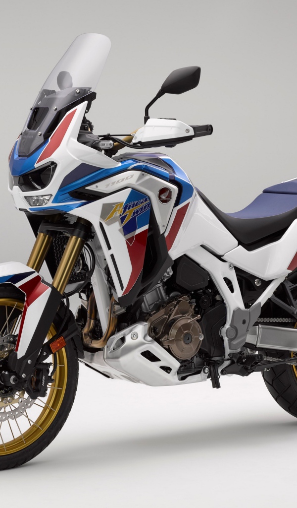 Спортивный мотоцикл Honda  CRF 1000 D, 2020  года на сером фоне