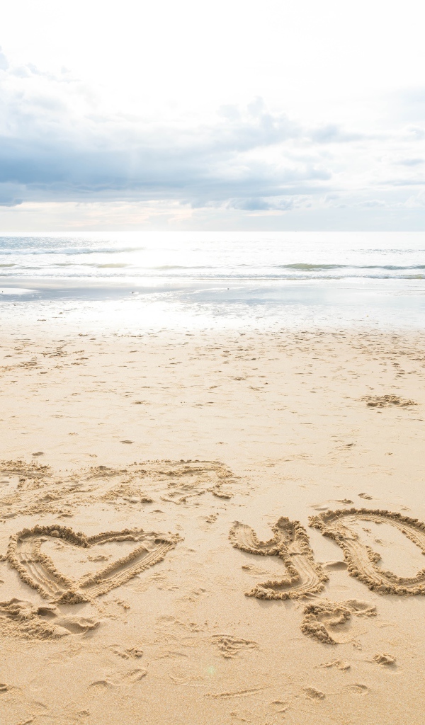 The inscription I love you on the sand by the sea