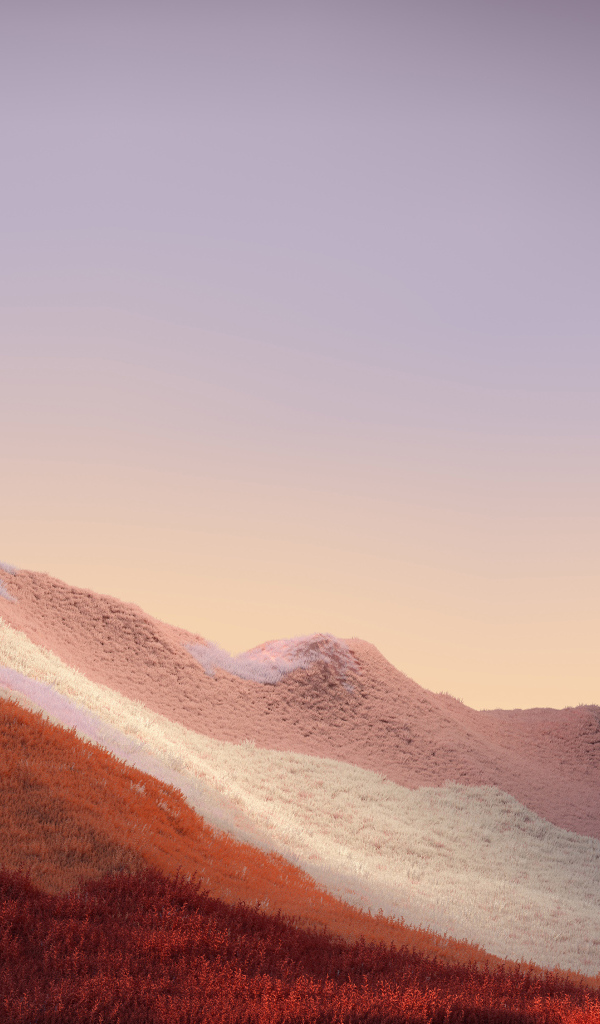 Покрытые травой горы на фоне неба