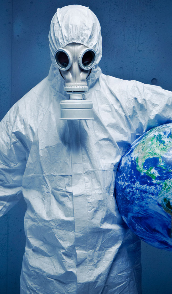 A man in a white protective suit saves the planet from a pandemic coronavirus covid-19