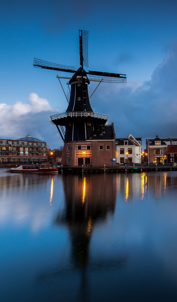 Old mill by the river in the evening, Netherlands