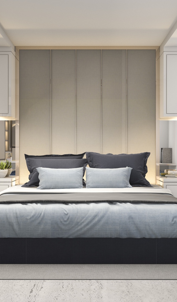 Большая двуспальная кровать в серой спальне