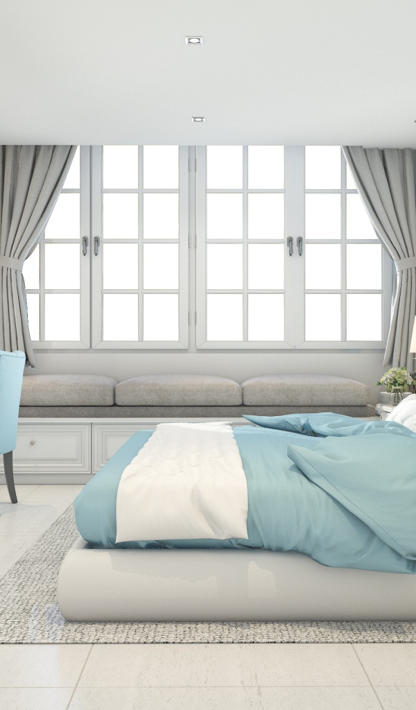 Большая спальня в серых тонах с кроватью и окнами