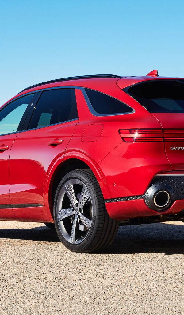 Красный автомобиль Genesis GV70 2.5T AWD 2021 года вид сзади 