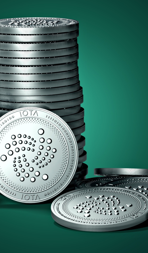 Монеты IOTA на зеленом фоне