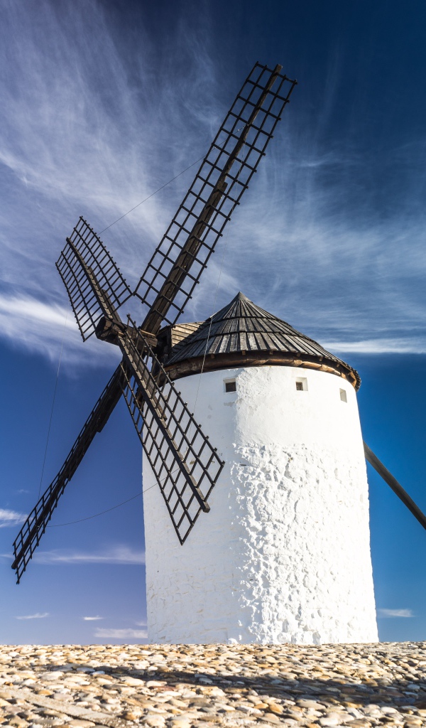 White windmill on blue sky background