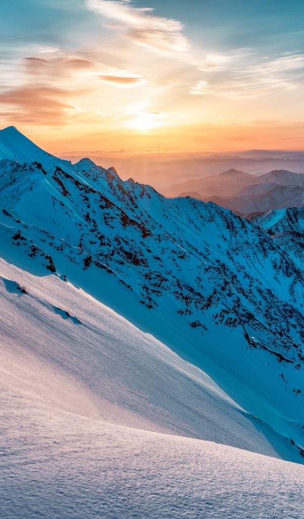 Beautiful view of the snow-capped mountains at sunrise