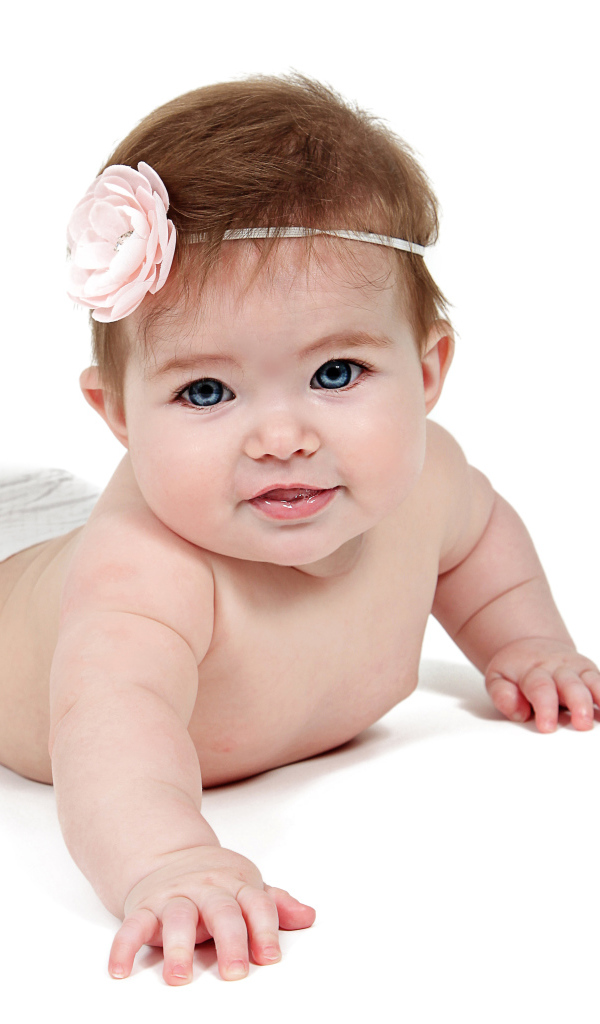 Smiling little blue-eyed baby on a white background