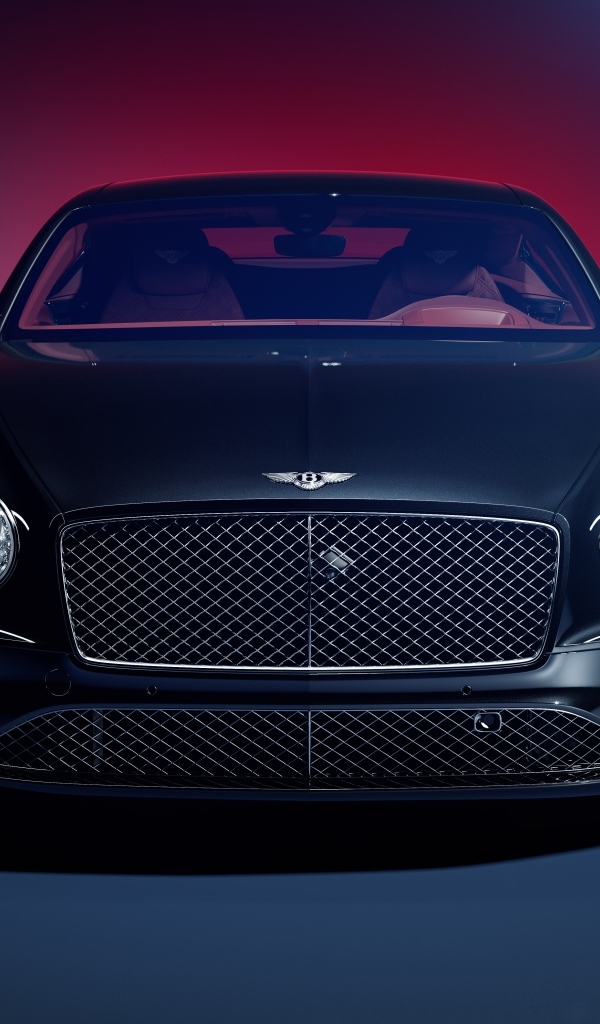 Вид спереди на автомобиль Bentley Continental GT на синем фоне