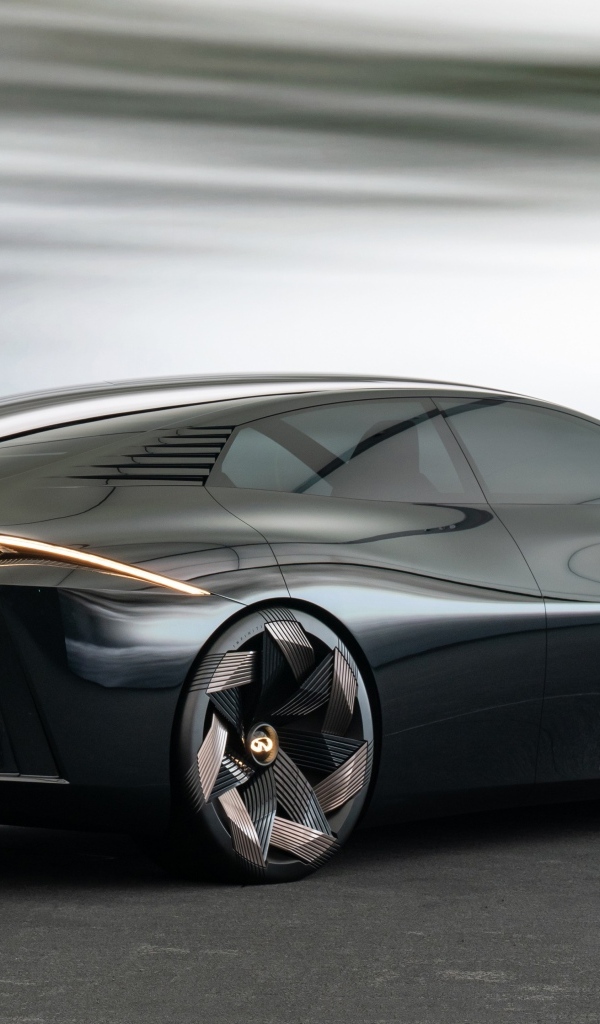 Вид сзади на черный автомобиль концепт Infiniti Vision Qe 2023 года