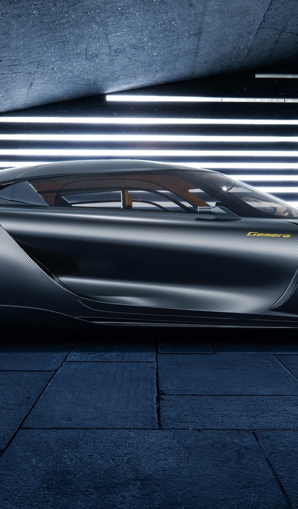 Серебристый автомобиль Koenigsegg Gemera вид сбоку