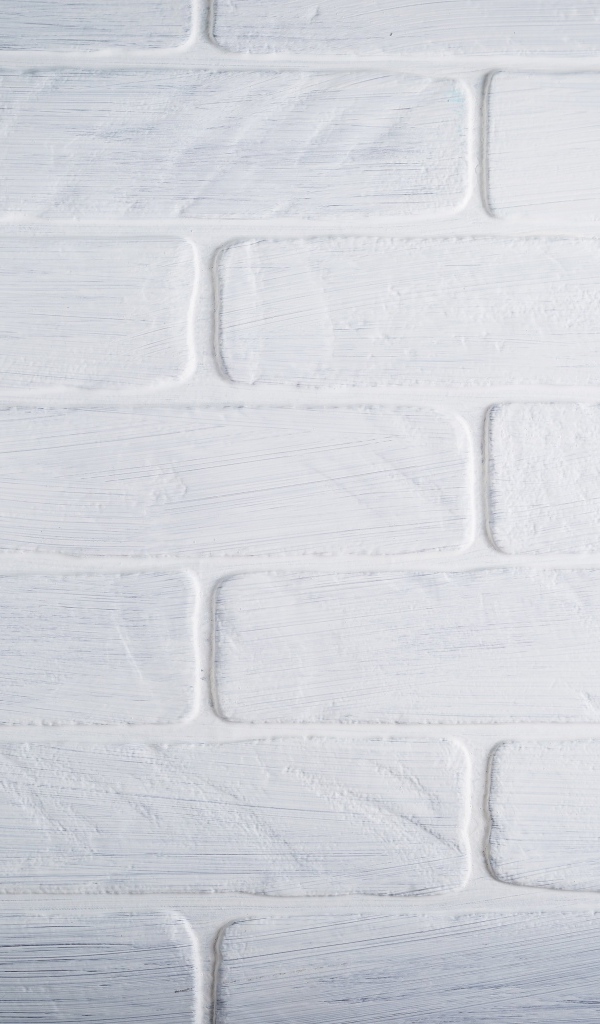 Белая кирпичная стена крупным планом