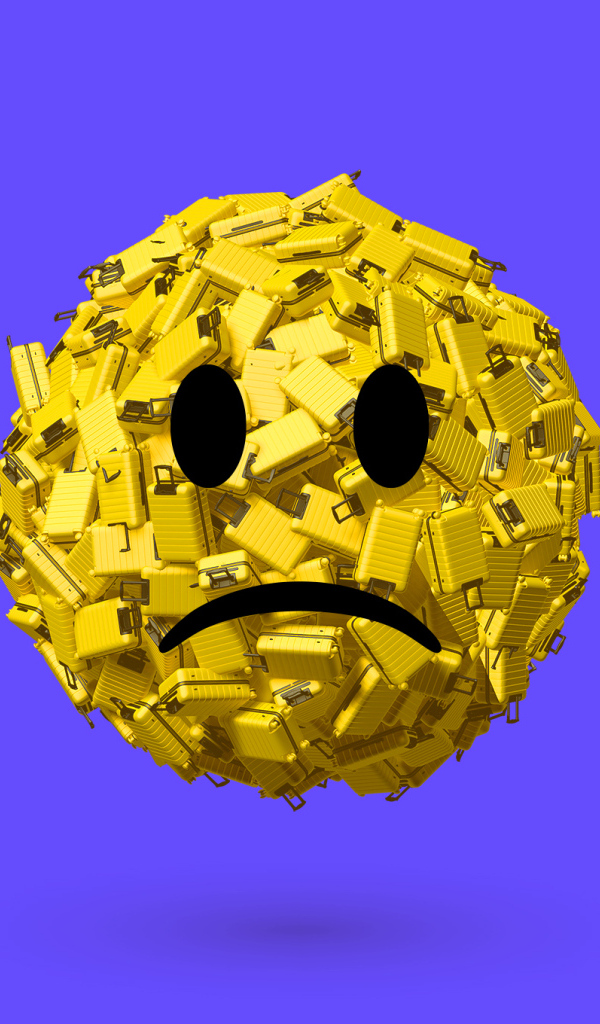 Грустный смайлик из чемоданов на синем фоне