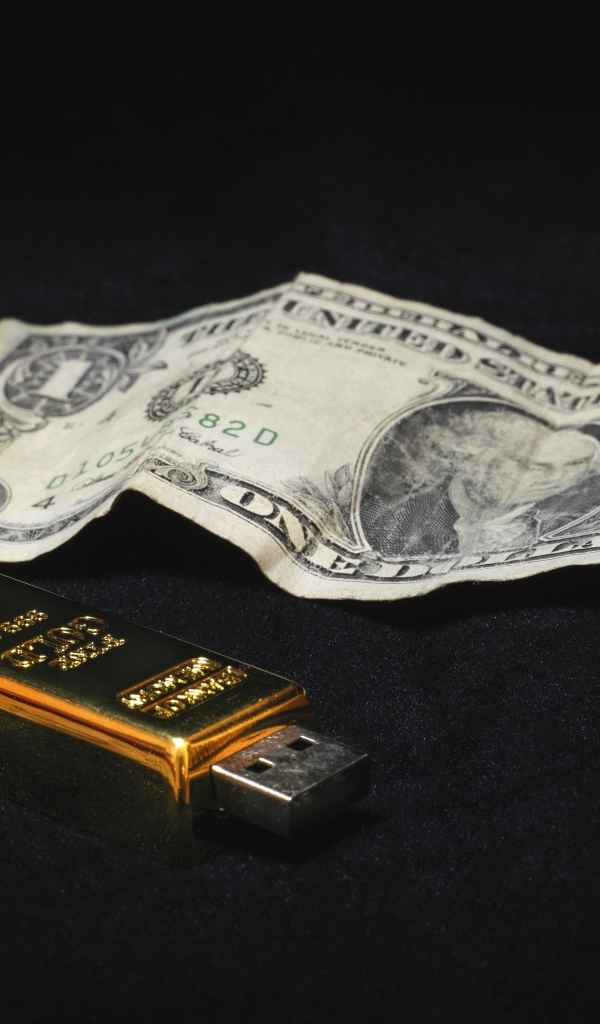 Один доллар и флешка на черном фоне
