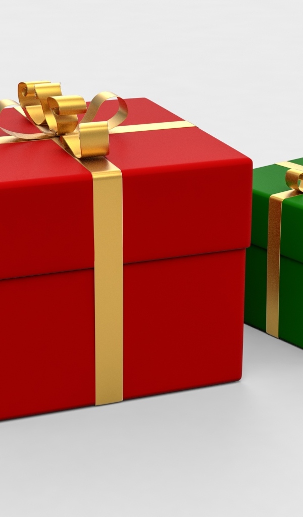 Красная и зеленая подарочная коробка на белом фоне