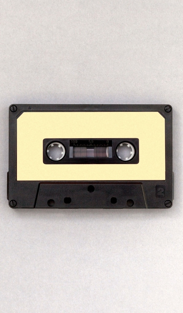 Старая кассета на сером фоне