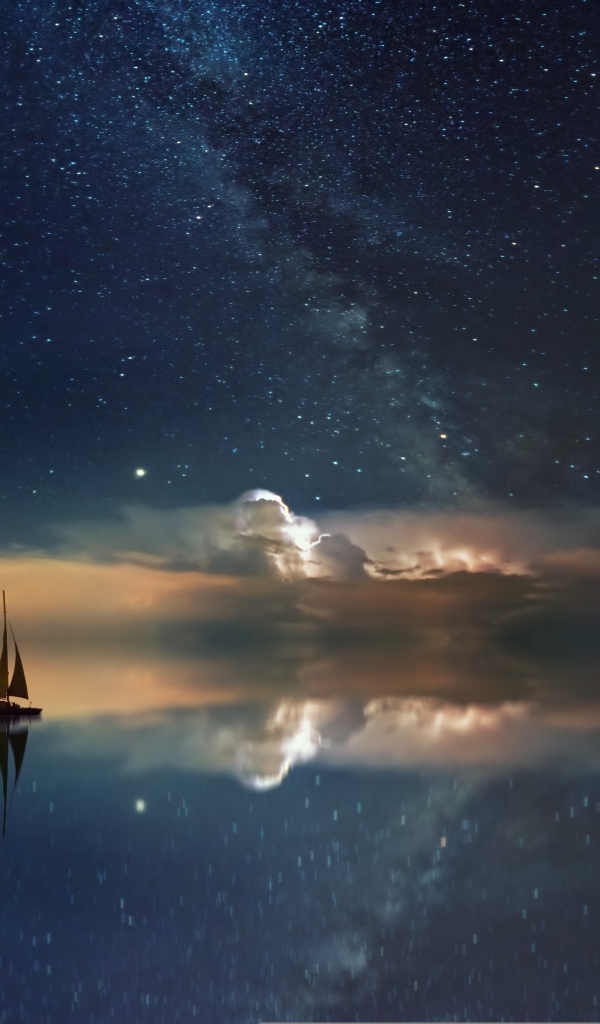 Парусник в море соединяющемся с небом