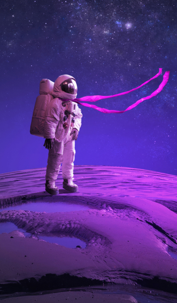 Астронавт стоит на поверхности планеты