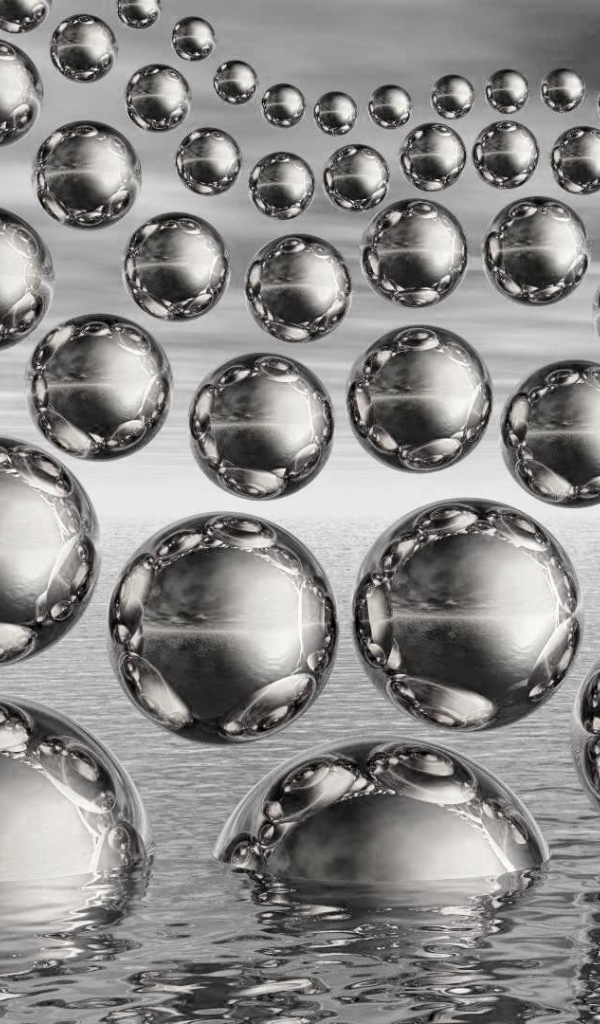 Много стеклянных 3д шаров в полете на сером фоне