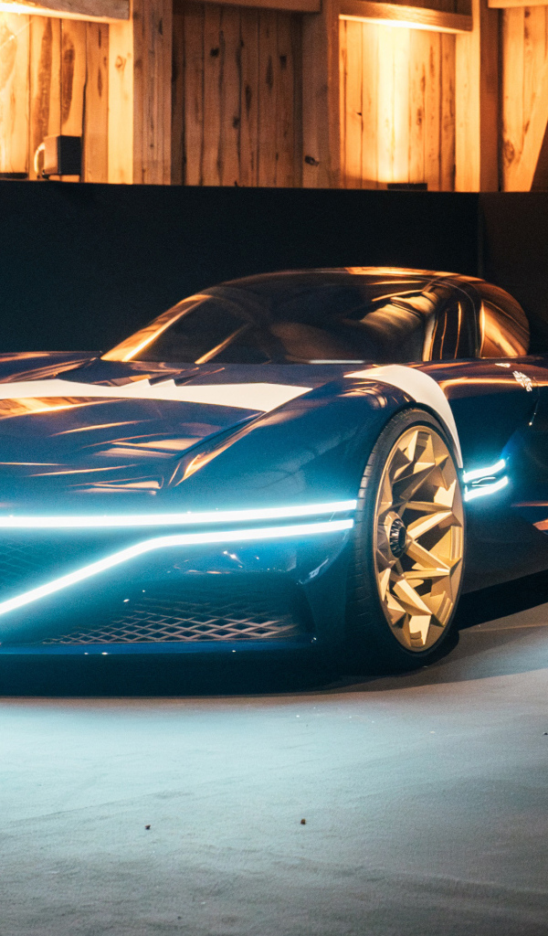 Автомобиль Genesis X Gran Berlinetta Tribute 2024 года с включенными фарами