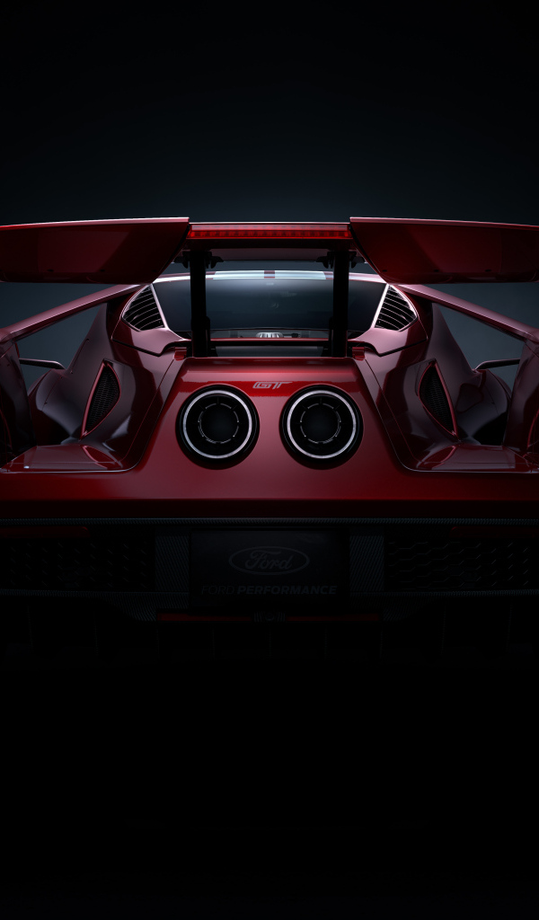 Вид сзади на автомобиль Ford GT  на черном фоне