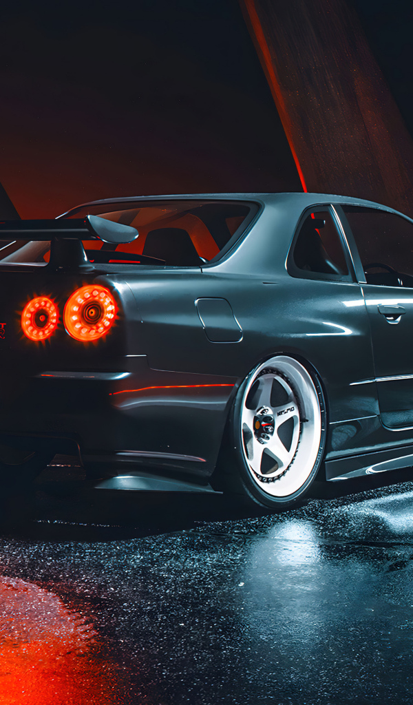 Черный автомобиль Nissan Skyline GTR R35 вид сзади