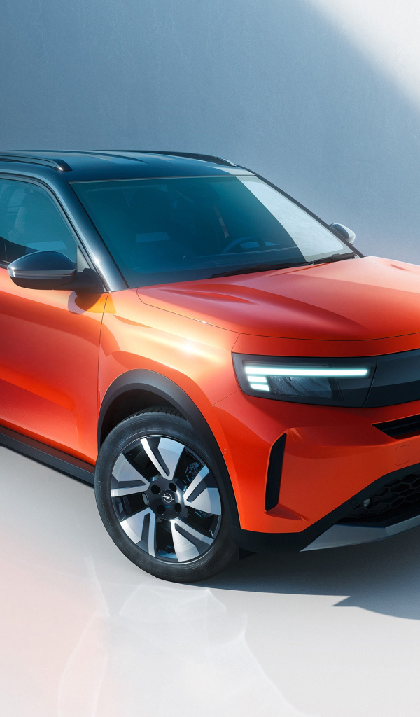 Красный автомобиль Opel Frontera Electric 2024 года