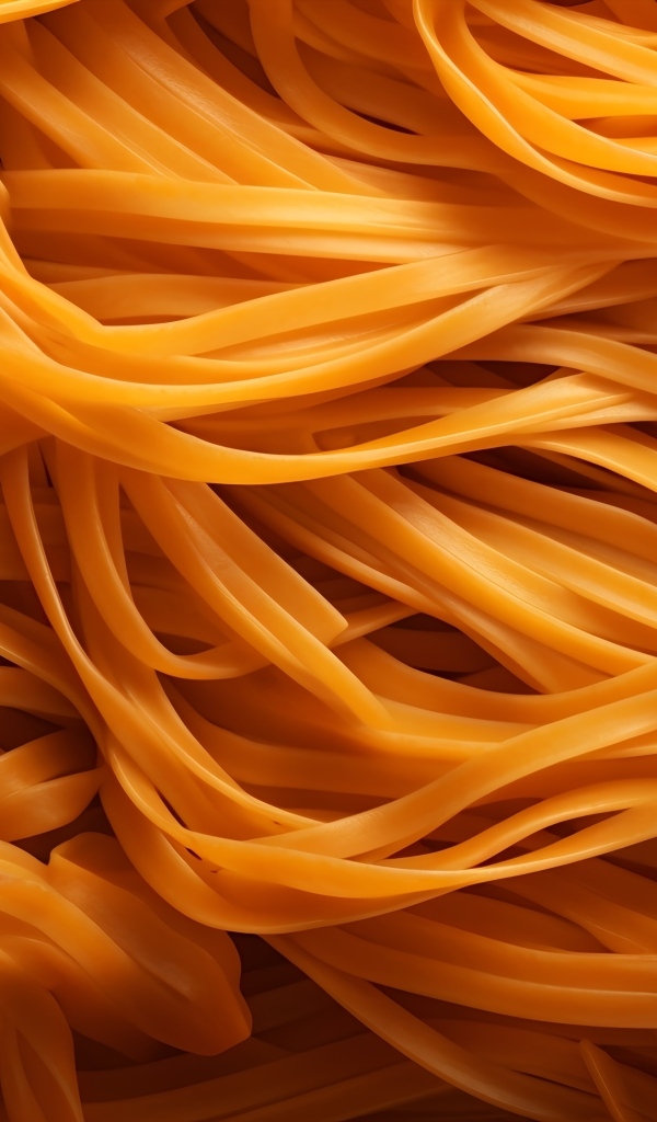 Оранжевые спагетти крупным планом