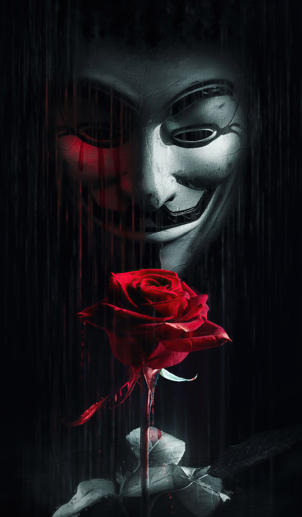 Человек в маске анонимуса с красной розой