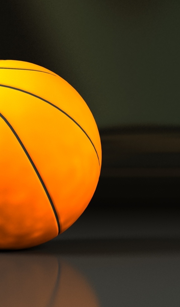 Большой оранжевый мяч на сером фоне