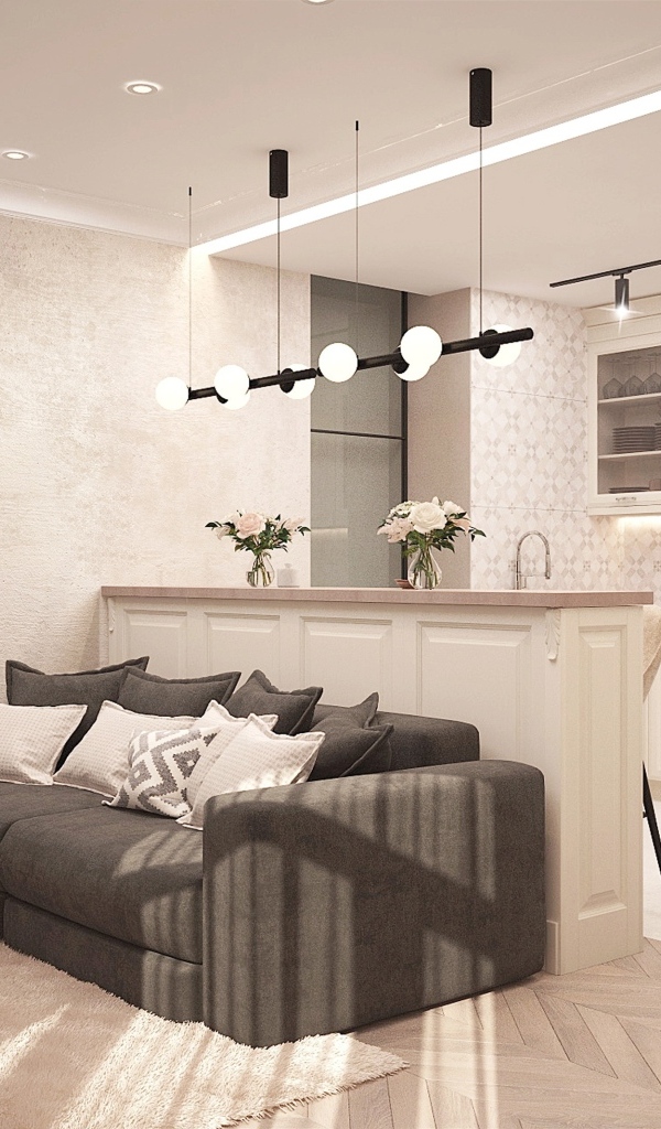 Светлая гостиная с камином и кухней