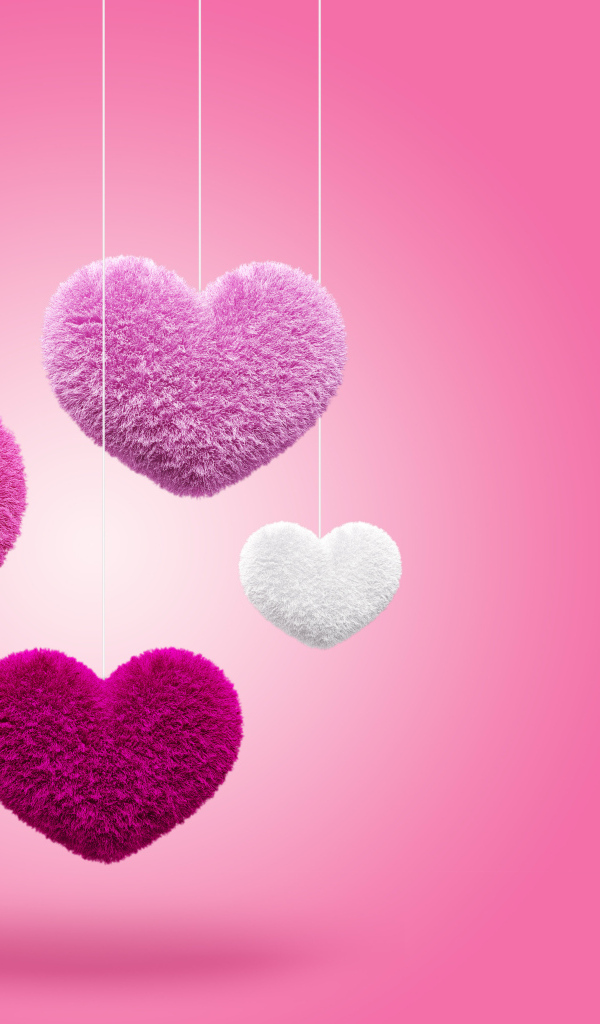 Пушистые сердечки на веревках на розовом фоне