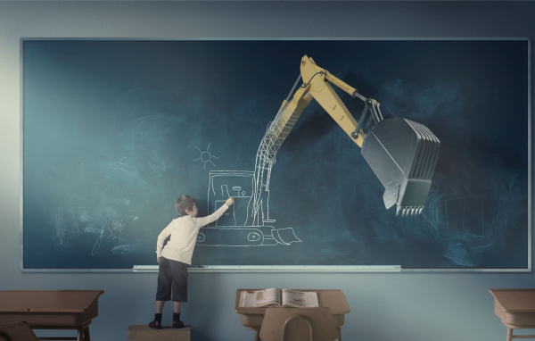 Мальчик рисует экскаватор