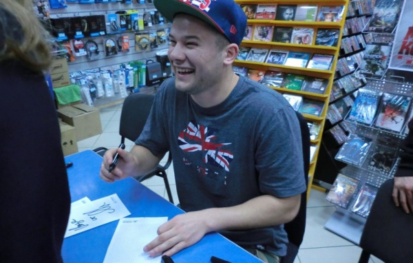 Max Korzh autographing