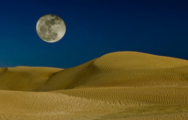 Moon over the sand dunes